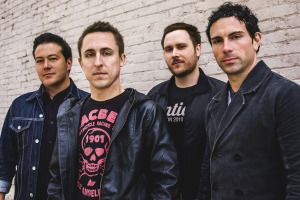 Yellowcard. L - R: Sean Mackin (Violin), Ryan Key (Vocals/Guitar), Ryan Mendez (Guitar), Josh Portman (Bass)
